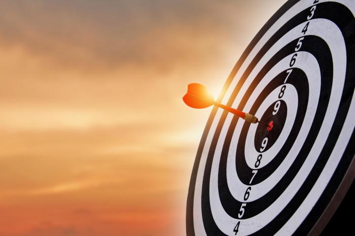 Dart arrow hitting in the bullseye center of dartboard. concept of ... How to to get rid of love handles