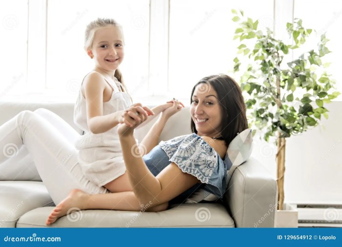 Portrait of Beautiful Mother and Her Little Daughter Sitting Together ... How to cite a picture